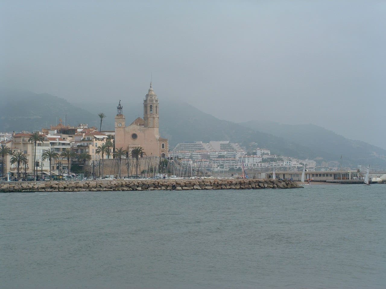 Sitges seen from the water, the church of Sant Bartomeu above the shore